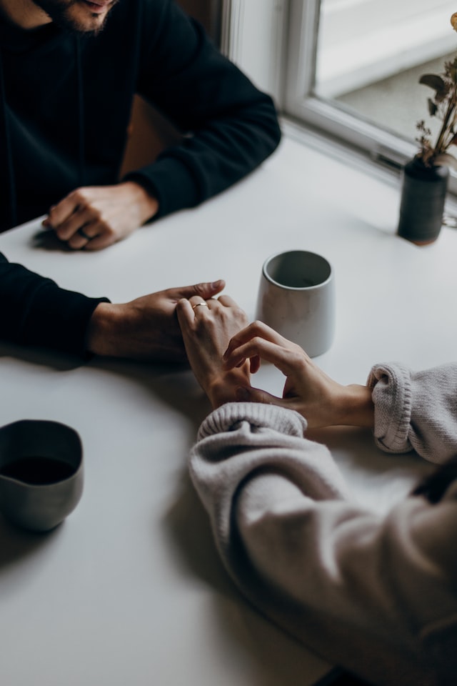 Couple holding hands