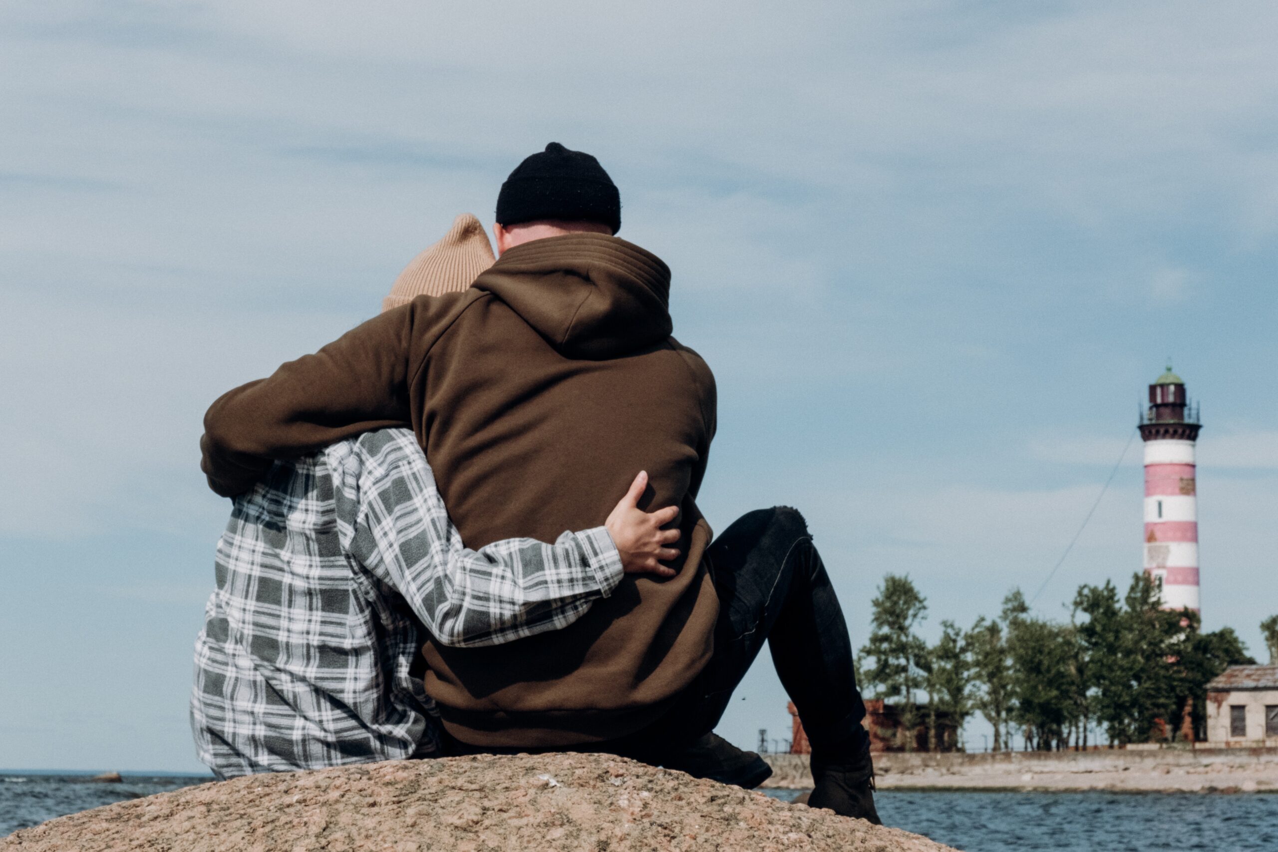 Couple Hugging Each Other At a Beach - Thor's Treatment