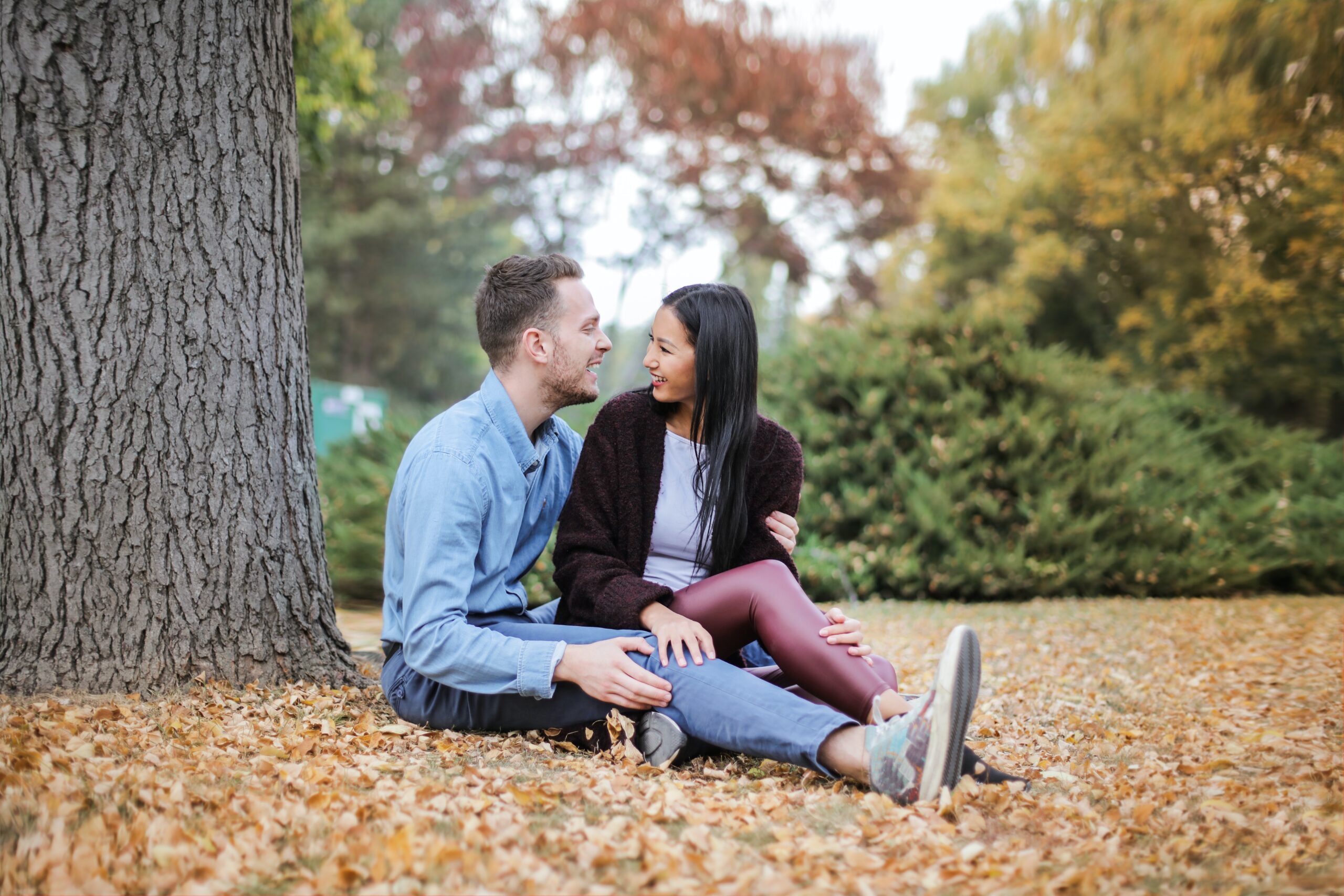 A couple sitting together at a park