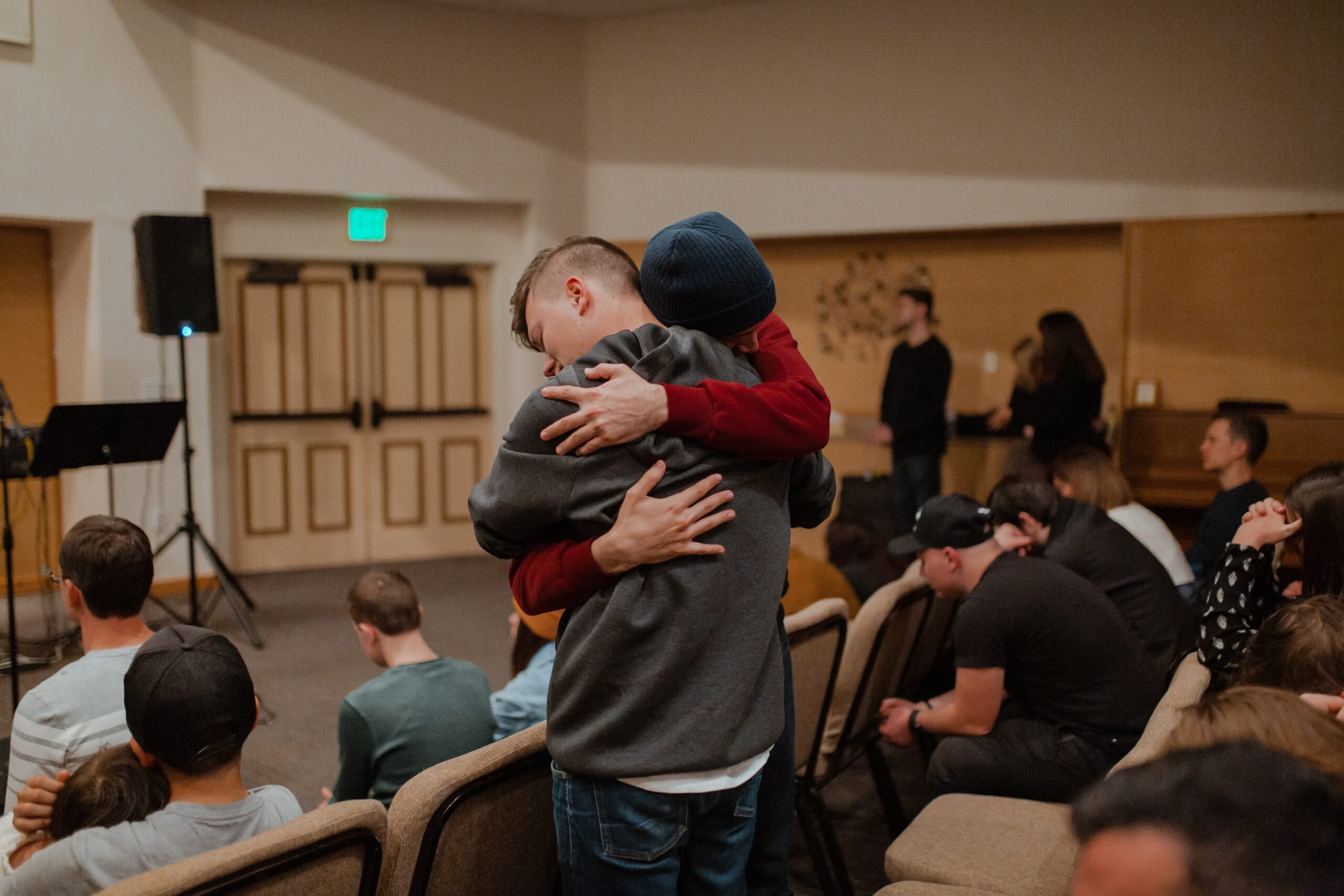 Two people hugging each other